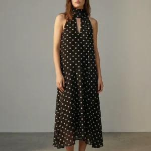 Robe noire fluide à pois blancs