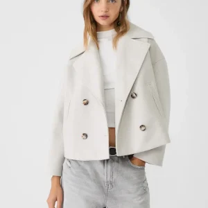 Manteau court pour femme avec double rangée de boutons et design intemporel